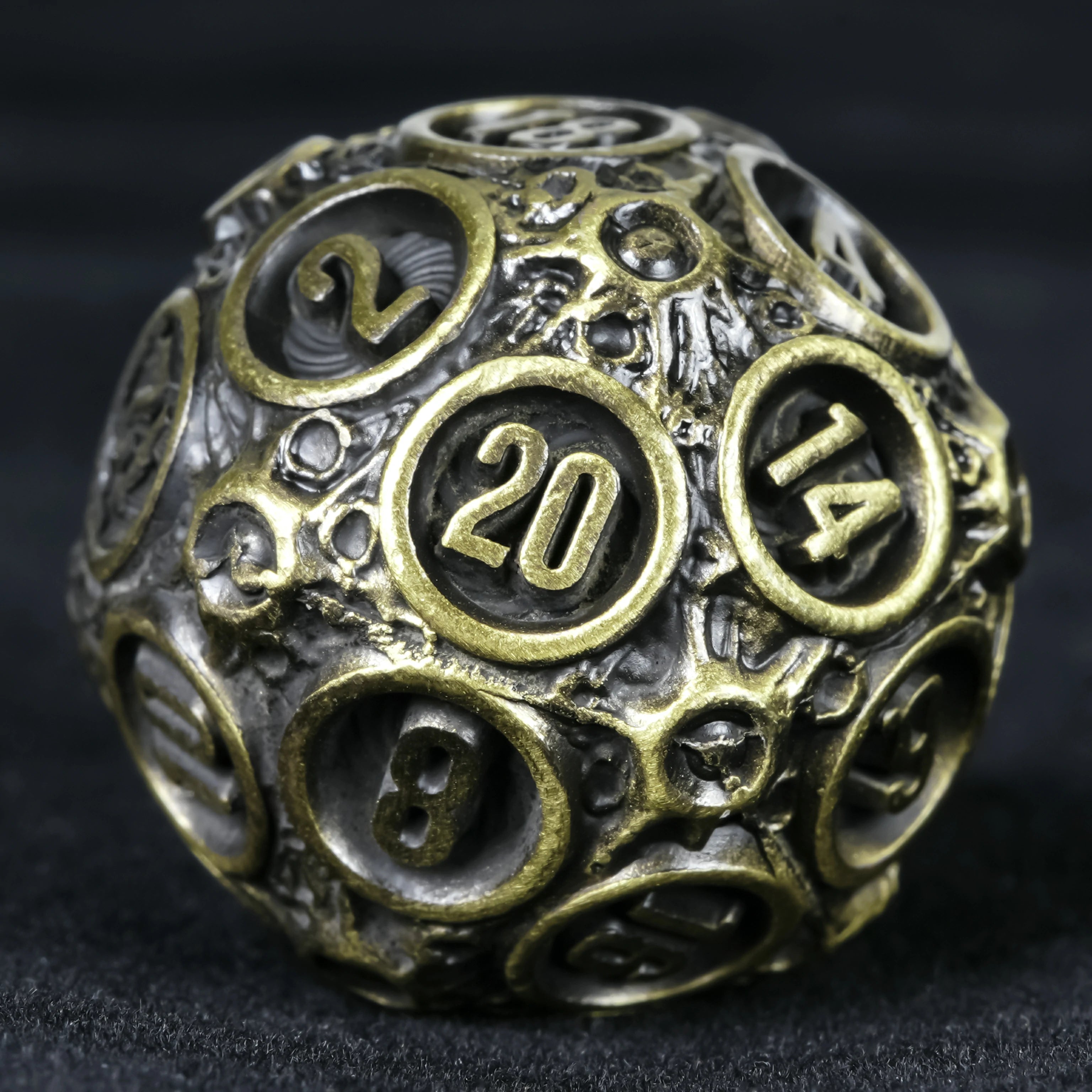 Spherical Planet Metal Dice Set - D20 ancient bronze hollow globe close-up showing number 20 face
