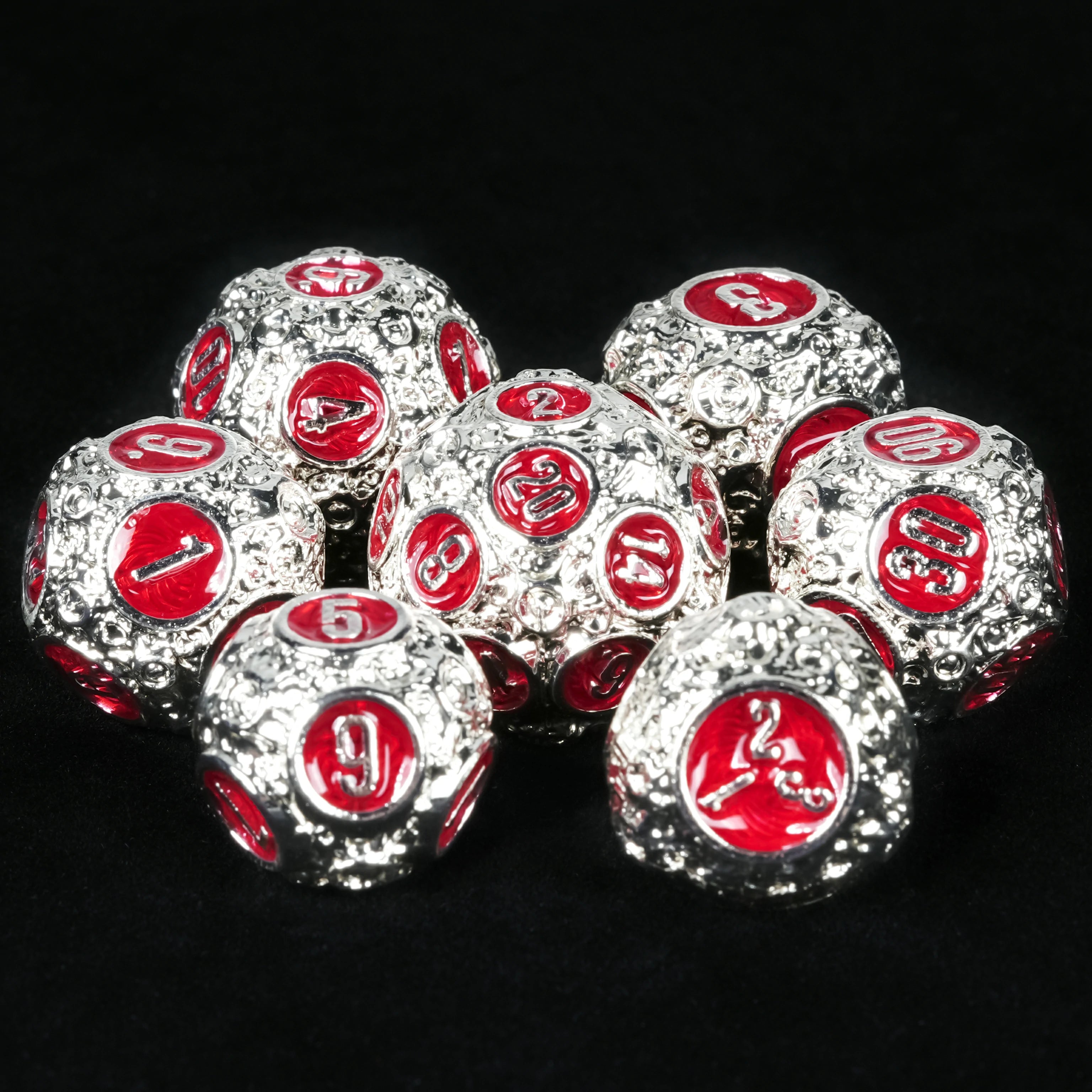 Spherical Planet Metal Dice Set – D20 ball dice close-up showing red enamel and textured silver surface