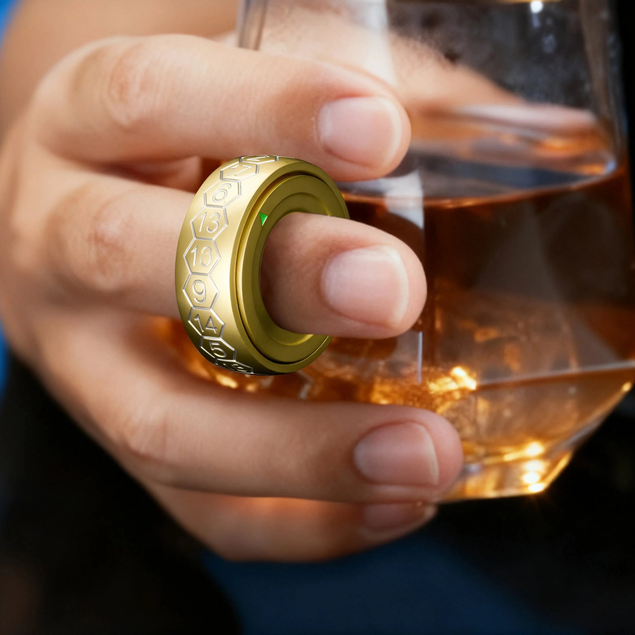 Cool gold spinning D20 dice ring with white numbers, wearable on the hand and spinning | Bear Dice