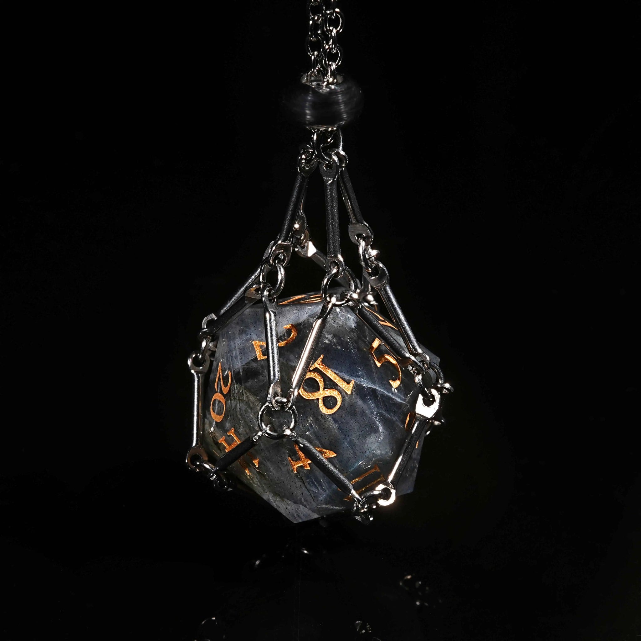 A silver dice necklace contains a natural grey marble D&D gemstone D20 dice with gold lettering | Bear Dice