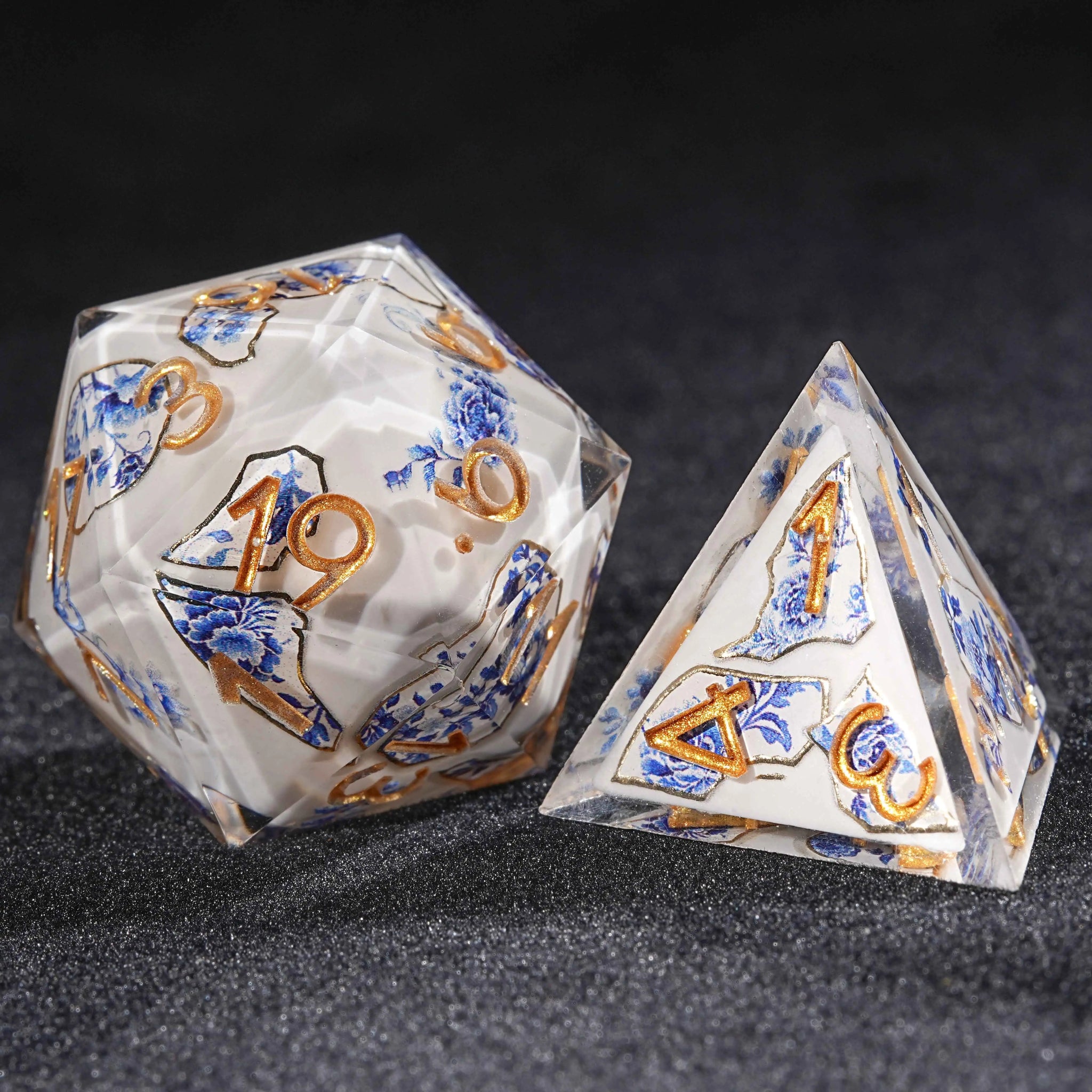 Transparent resin Oriental Blue and White Porcelain DND D20 and D4 dice, blue and white porcelain fragments with blue floral prints and gold engraved numbers | Bear Dice