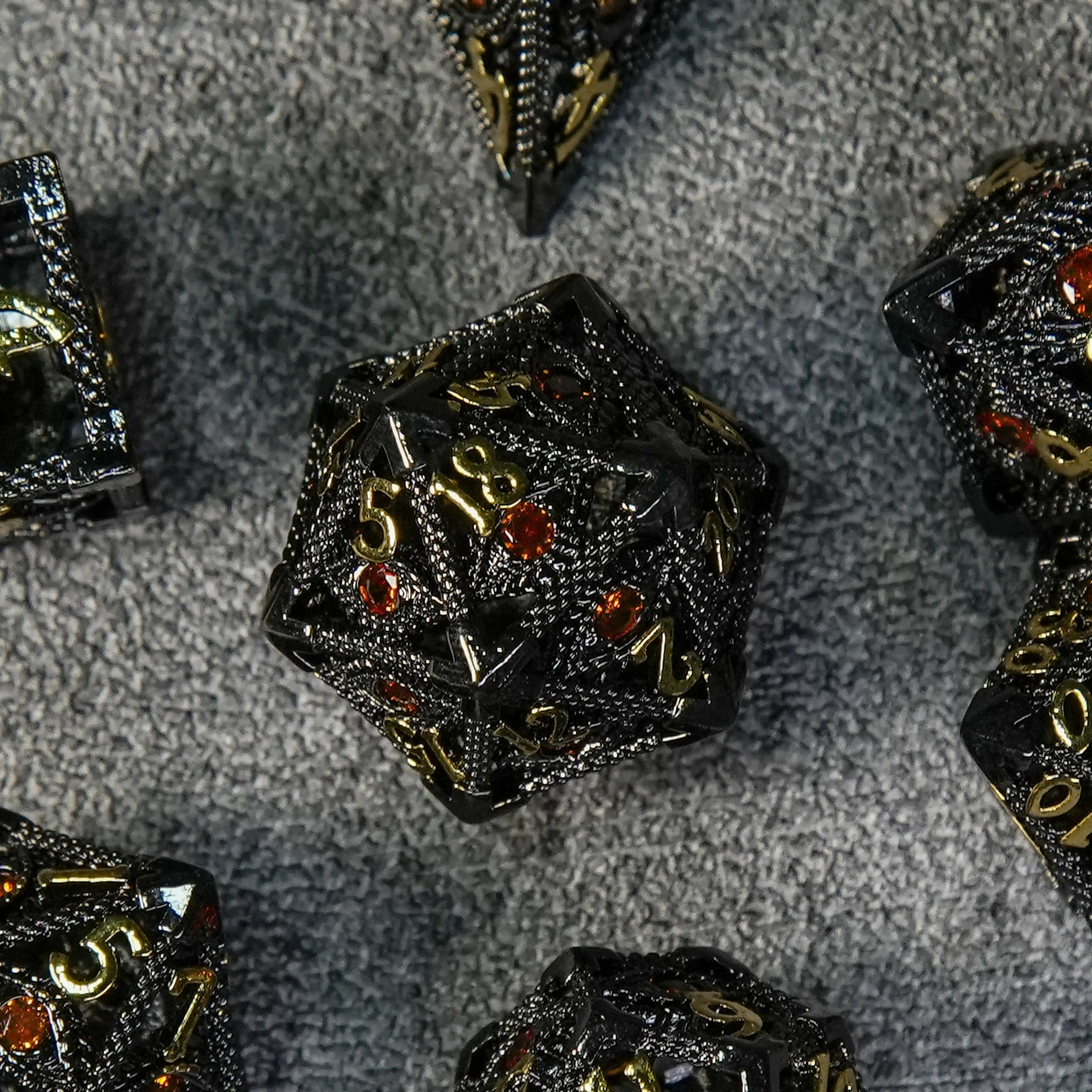 Ruby Demon's Eye Black Metal Hollow D20 Dice with Engraved Gold Numbers | Bear Dice