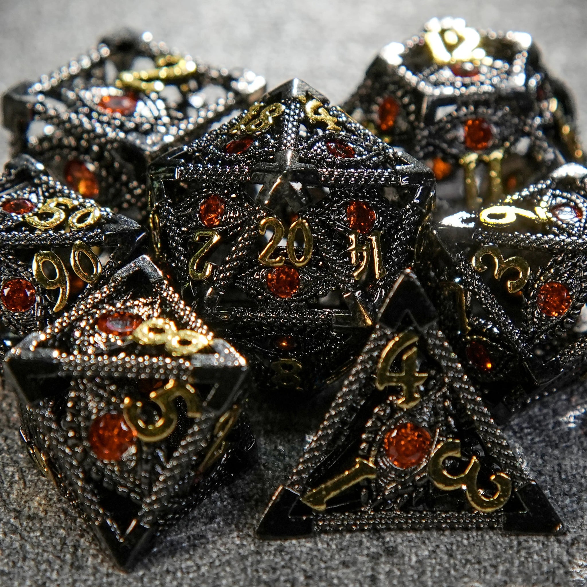 Ruby Devil's Eye Black Metal Hollow DND Dice Set with Engraved Gold Numbers | Bear Dice