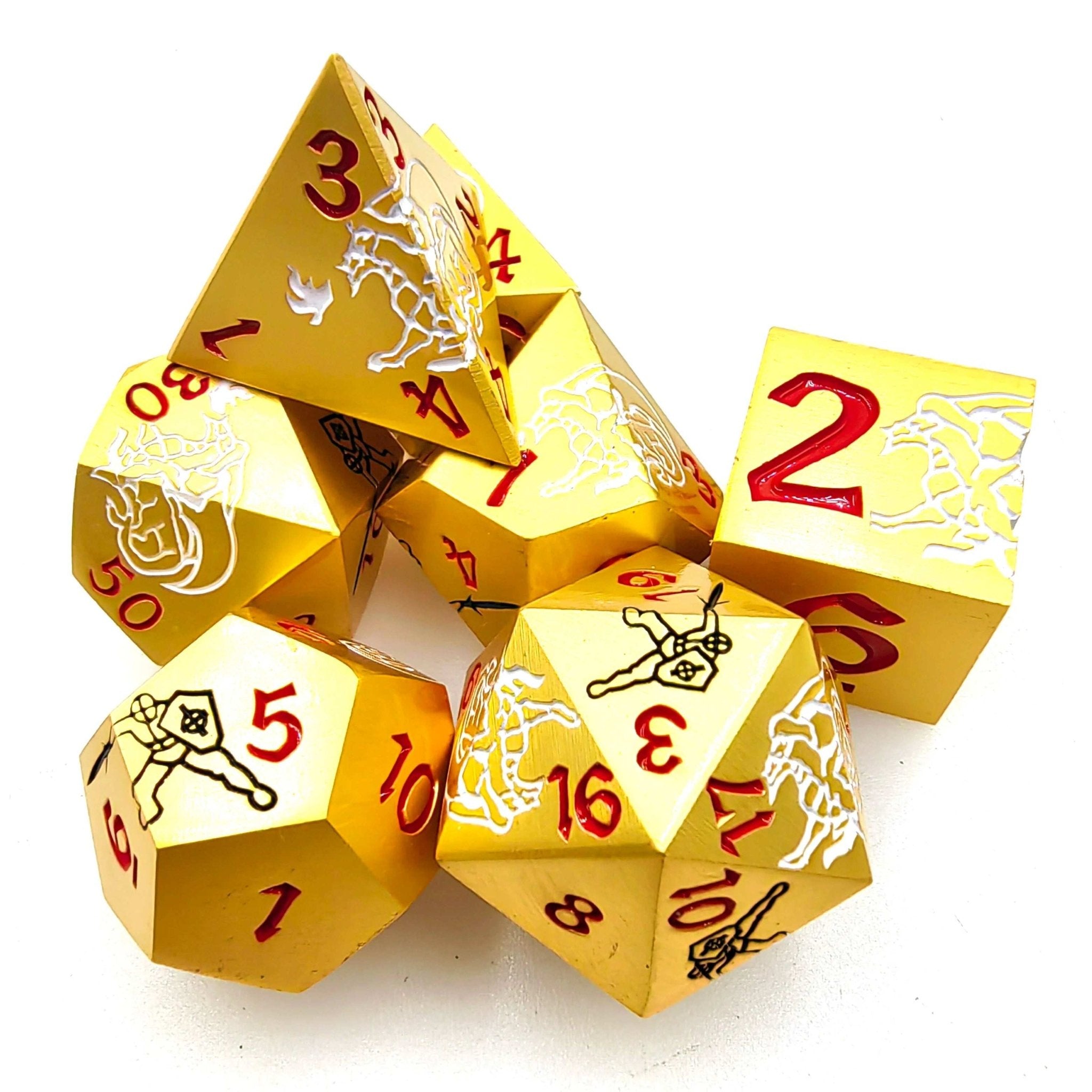 Seven Silver Dragon and Black Warrior gold metal DND dice (D4, D6, D8, D10, D%, D12, D20) stacked on a white table with red numbers | Bear Dice
