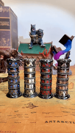 On the DND team running desktop, four metal dice tower rotators of different colors rotate smoothly, and stop rotating at the same time to get 6 kinds of DND dice readings.