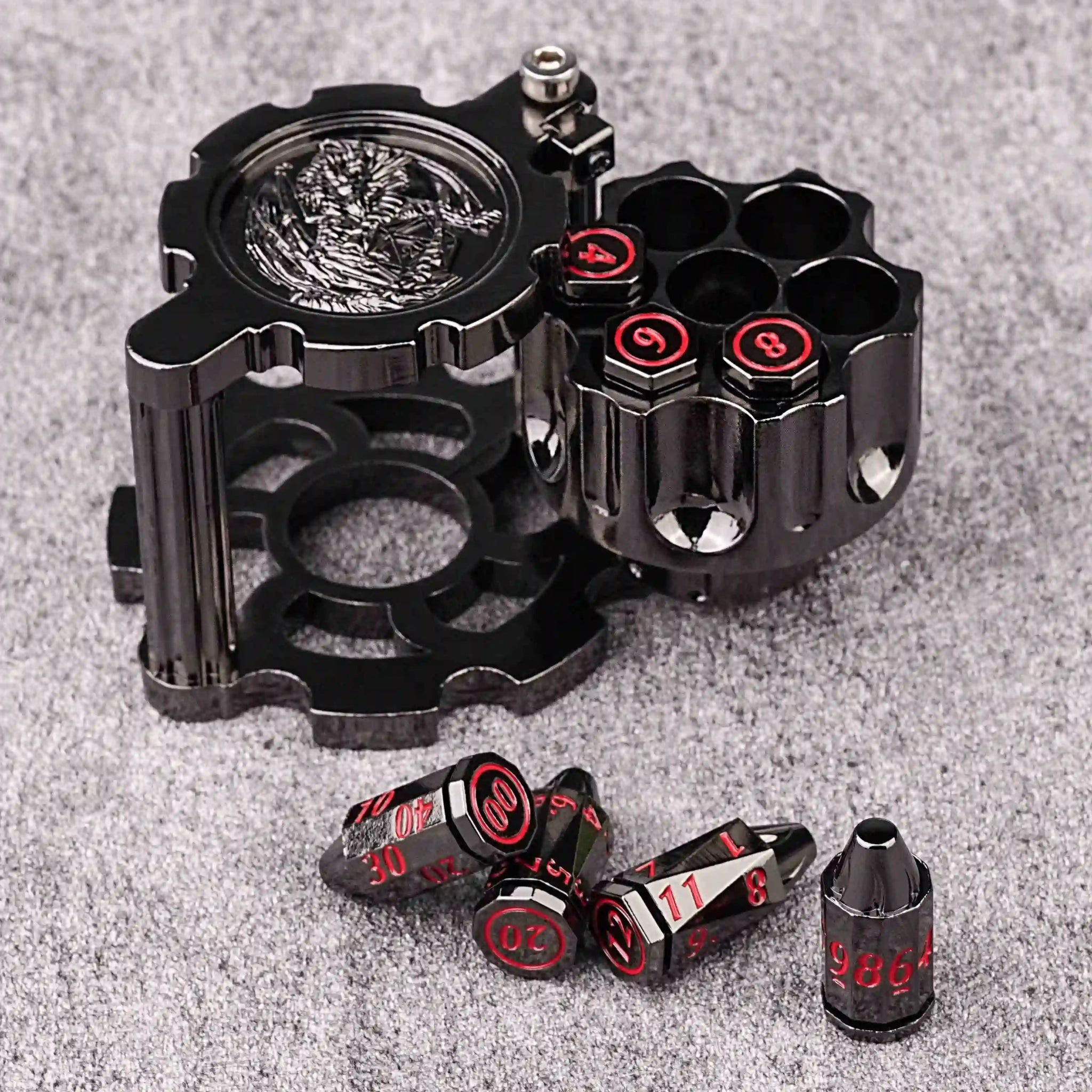 Unique DND Revolver Bullet Dice Set: Black nickel revolver dice rotating magazine with three black nickel DND bullet dice with red numbers. D10, D%, D12, and D20 bullet dice are placed on the front of the revolver magazine | Bear Dice