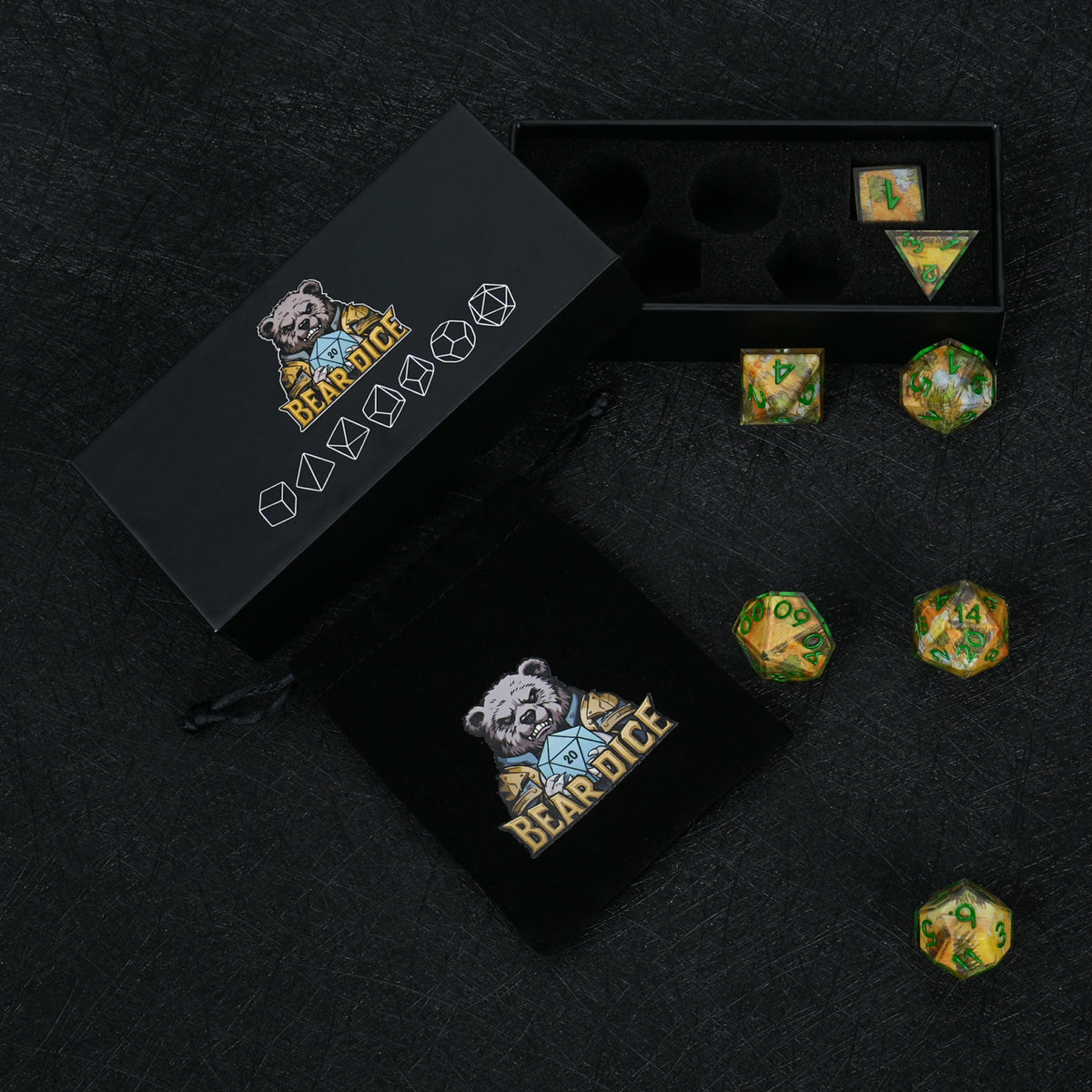 Seven autumn landscape resin dice with green numbers, displayed with a black Bear Dice box, foam insert and drawstring pouch