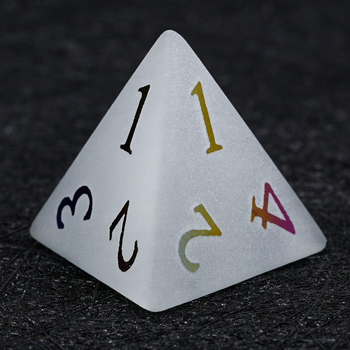 Gray frosted gemstone D4 die with multicolored electroplated numbers, shown in a close-up view of its triangular pyramid shape.