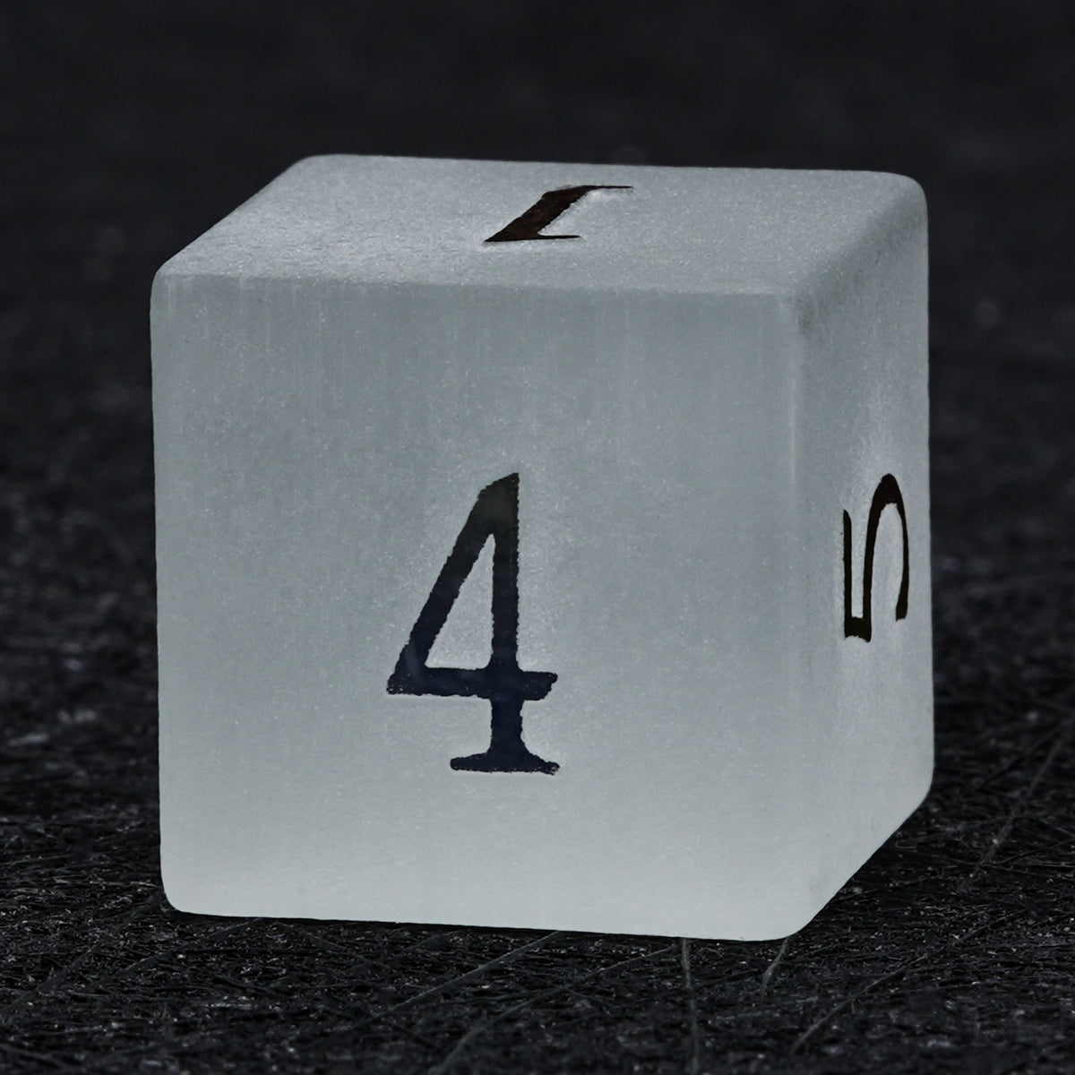 Gray frosted gemstone D6 die with electroplated numbers, showing its cube shape and the number 4 on the front face.