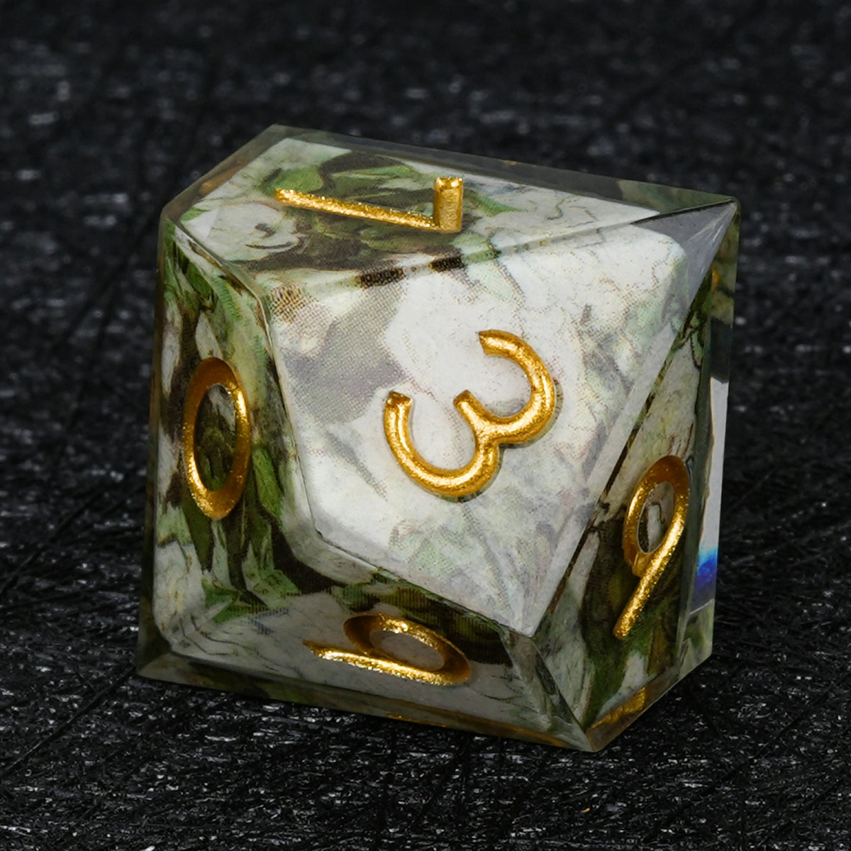 Ten-sided resin D10 with green and white wraparound decal artwork and gold numbers