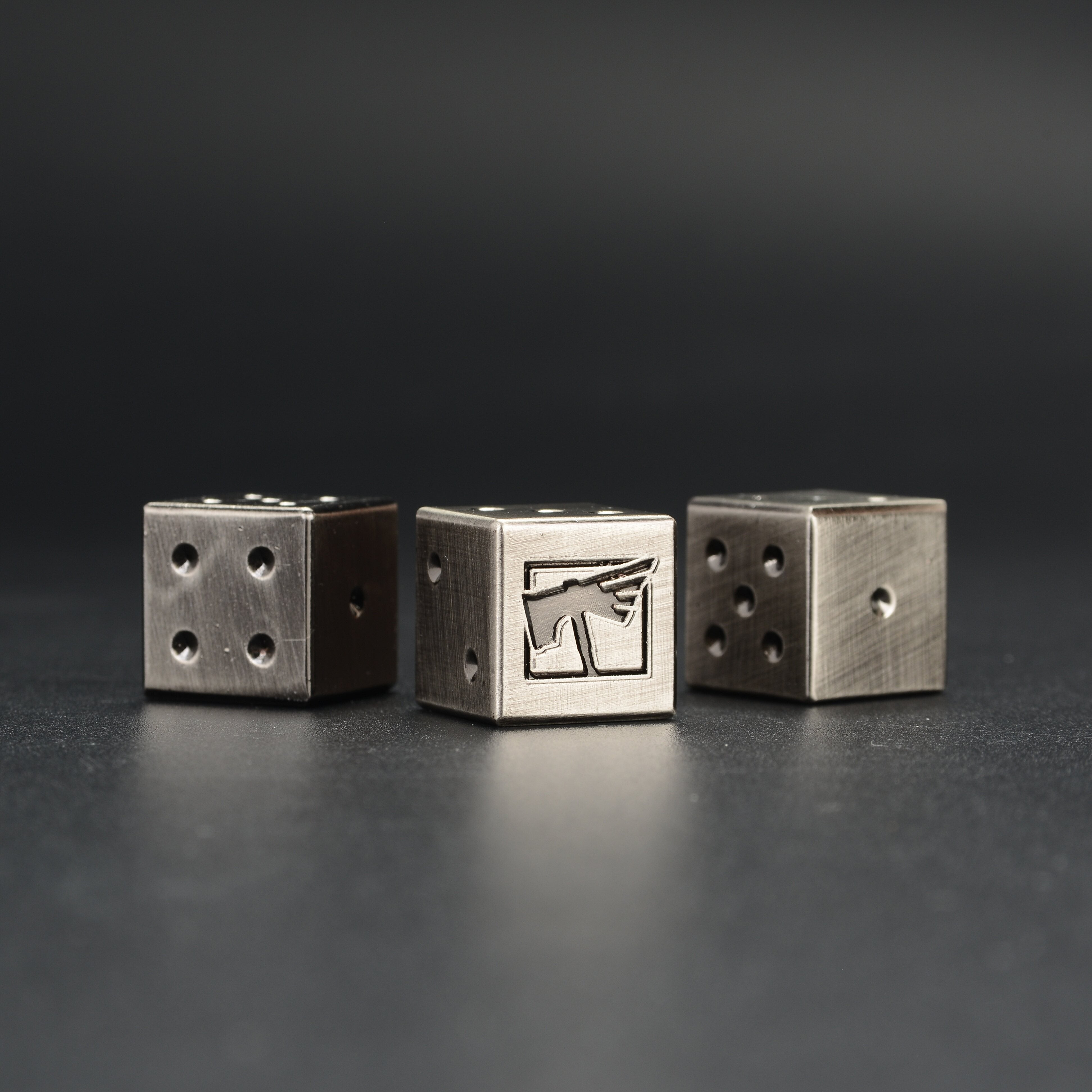Metal Warhammer 40K D6 Dice two dice close-up showing engraved faction emblem on 6-face | Bear Dice