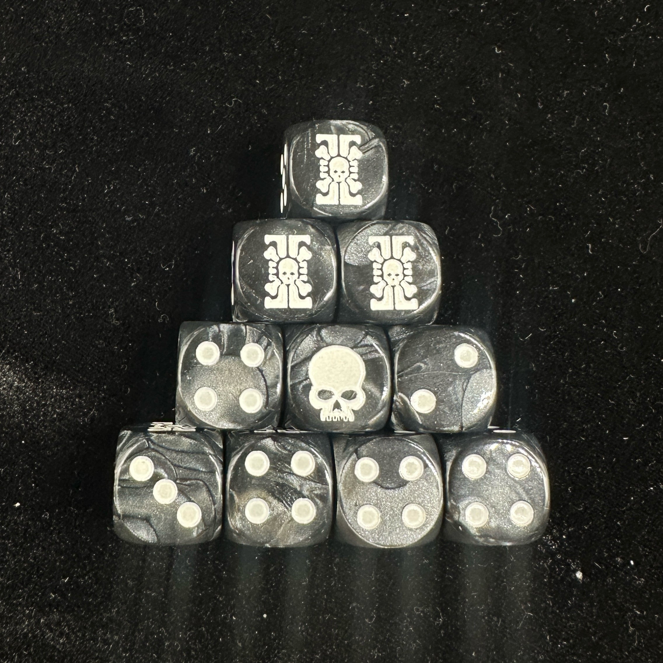 Warhammer 40K Deathwatch Acrylic D6 Dice Set of 10 — Pyramid Stack on Dark Background Showing Skull-Gear Badge 6-Face, Skull 5-Face and White Circular Pip Faces on Black Pearl Body | Bear Dice