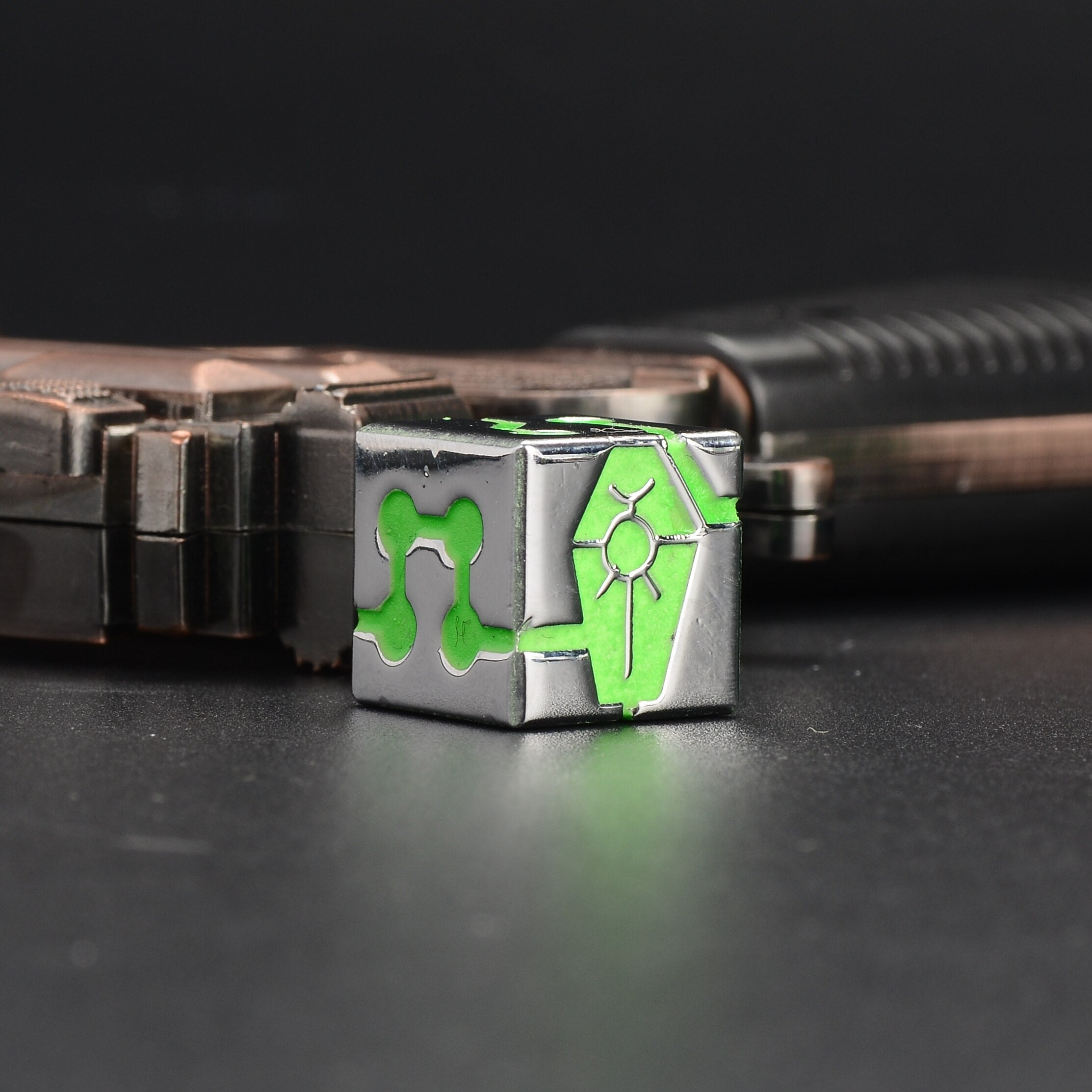 Warhammer 40K Necron-Themed Green Fluorescent D6 Dice side angle display with dark metal and green fluorescent finish | Bear Dice