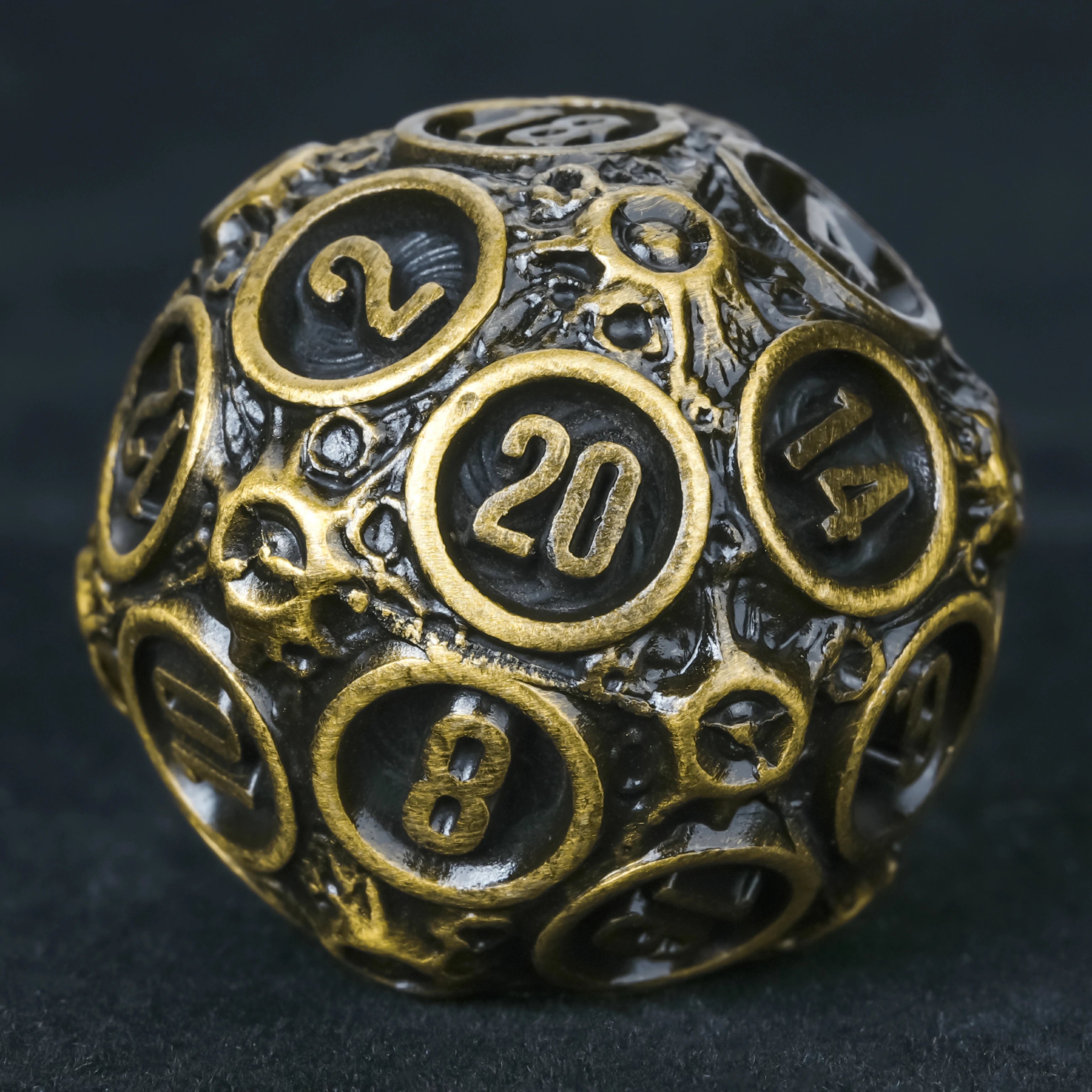 Spherical Planet Metal Dice Set – D20 close-up showing hollow bronze design