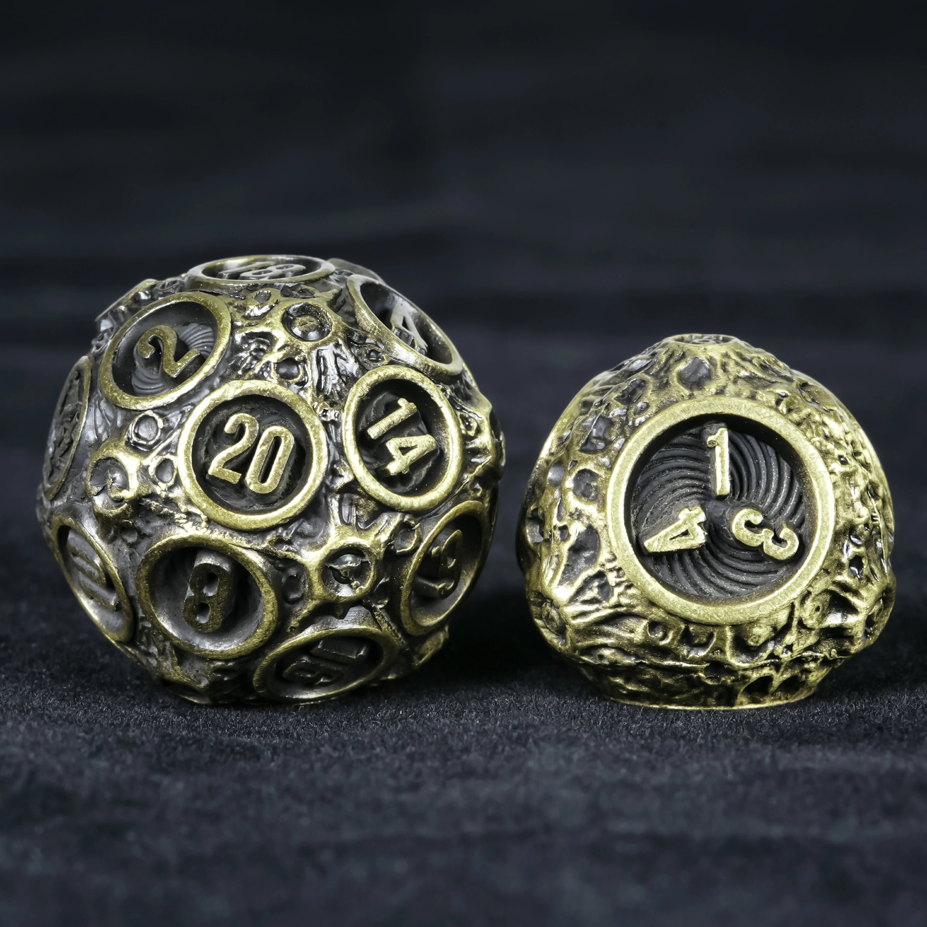 Spherical Planet Metal Dice Set - D6 top view showing number 5 face with hollow globe design