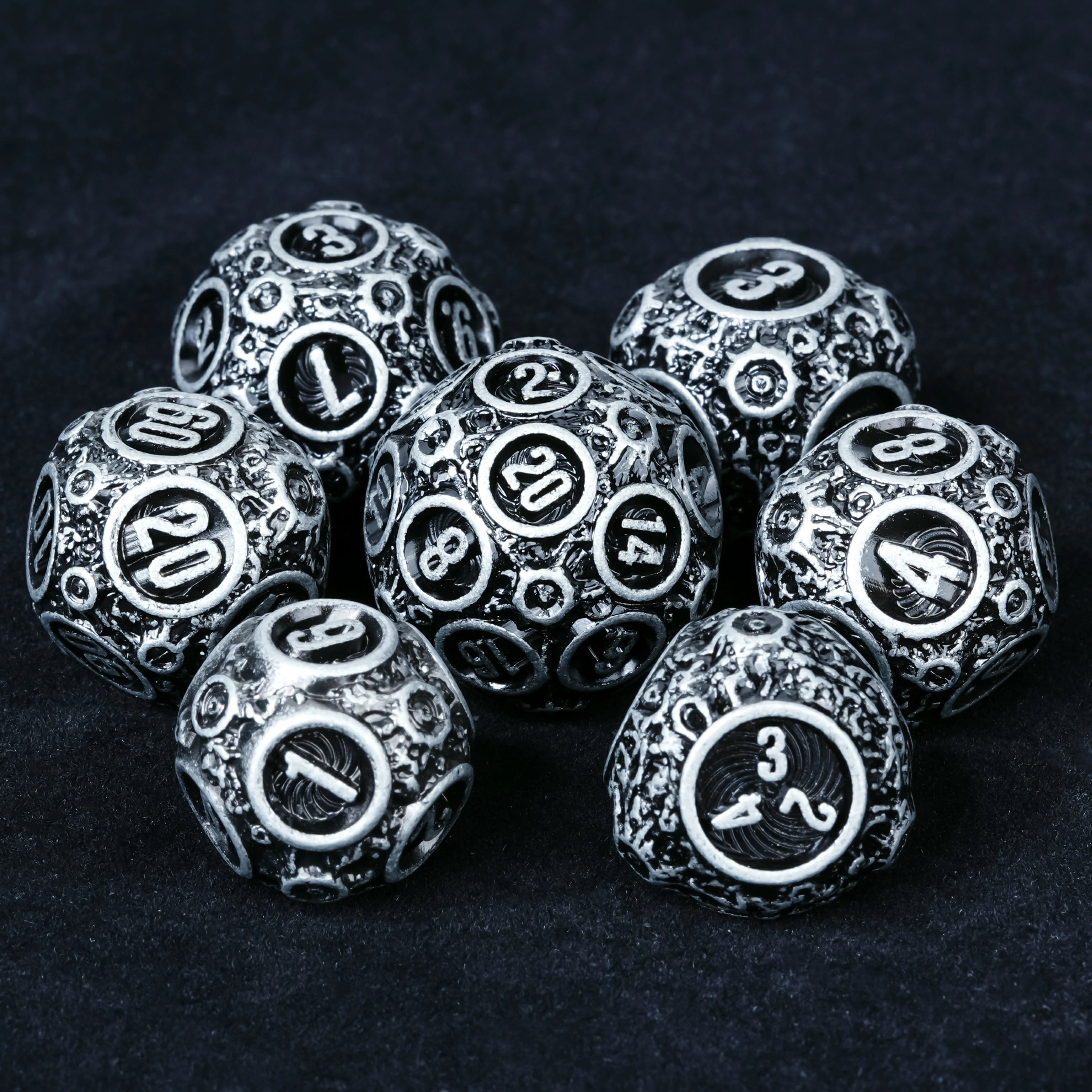 Spherical Planet Metal Dice Set D20 and D4 size comparison