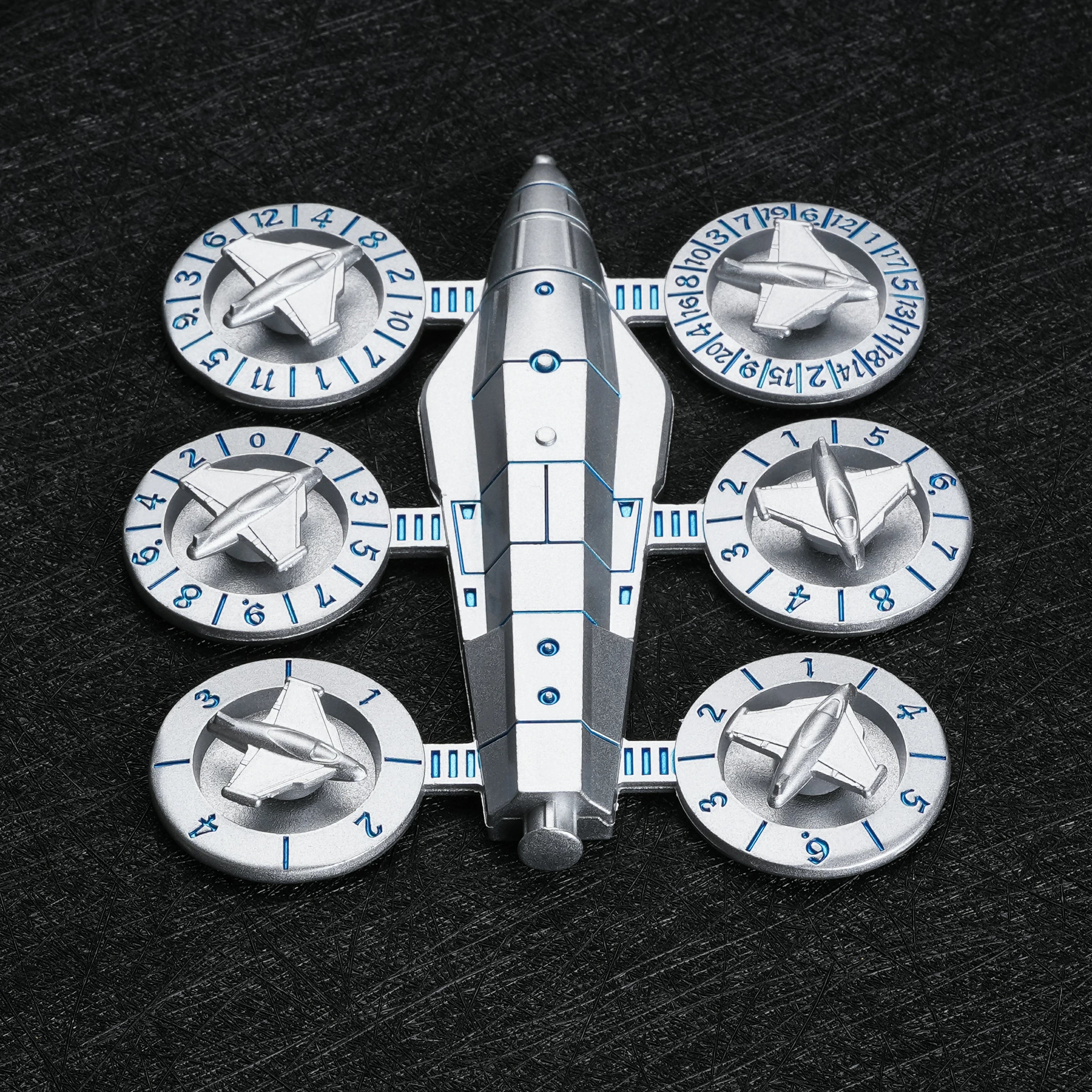 Spaceship Wing Spinner Metal Dice Set in three colorways – silver, gold, and gunmetal black