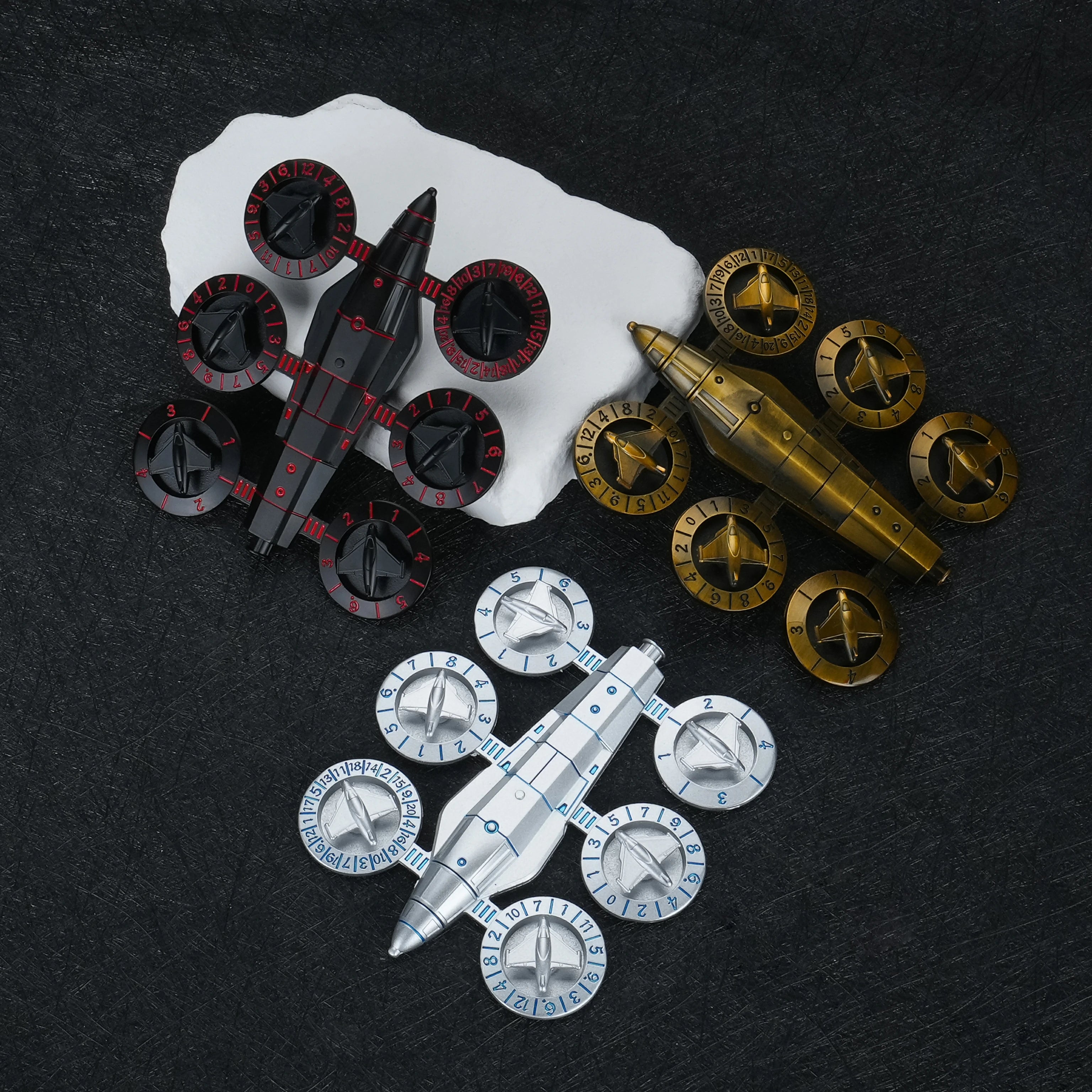Spaceship Wing Spinner Metal Dice Set black red top view flat lay