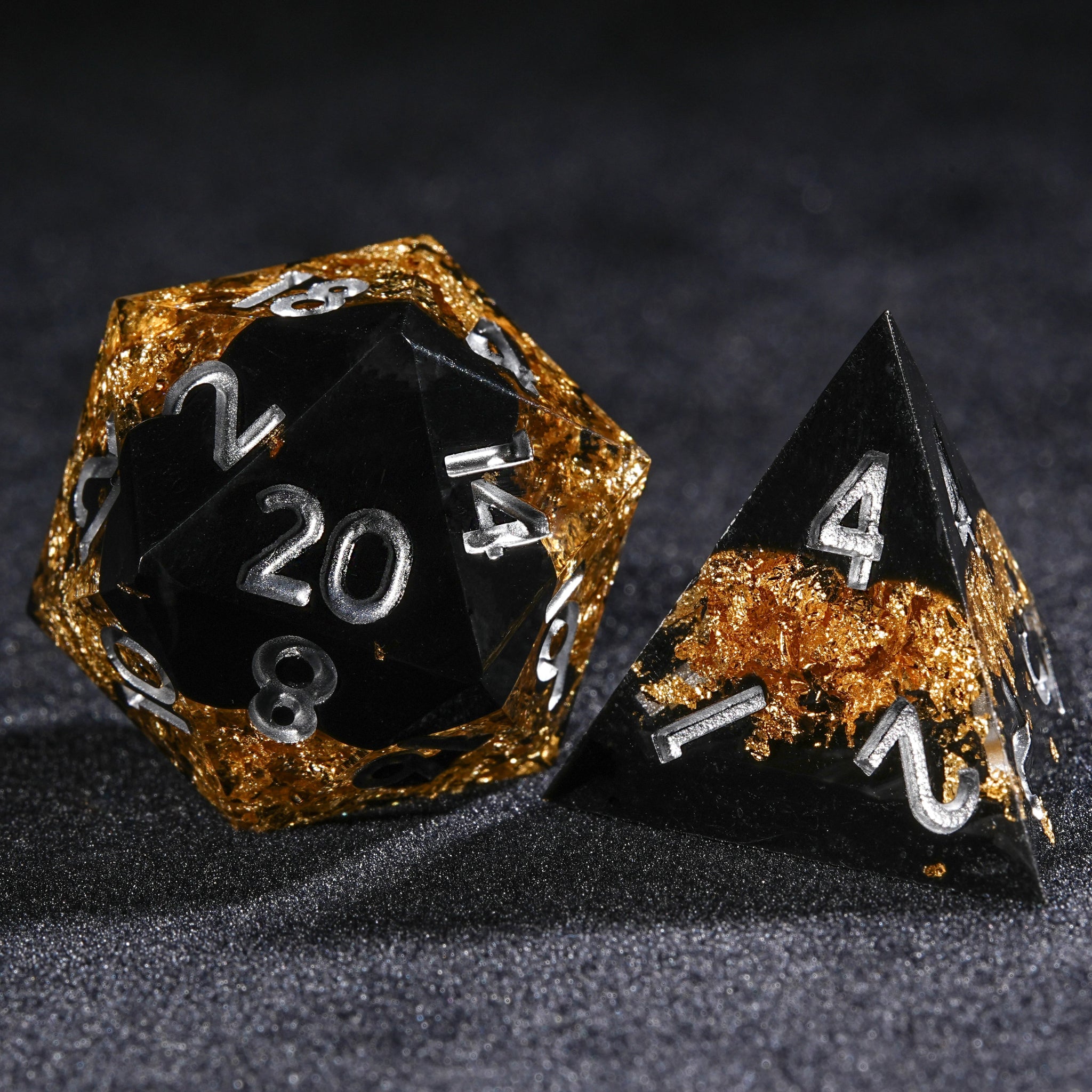 Black gold Galaxy resin DND D20 and D4 dice with silver numbers | Bear Dice