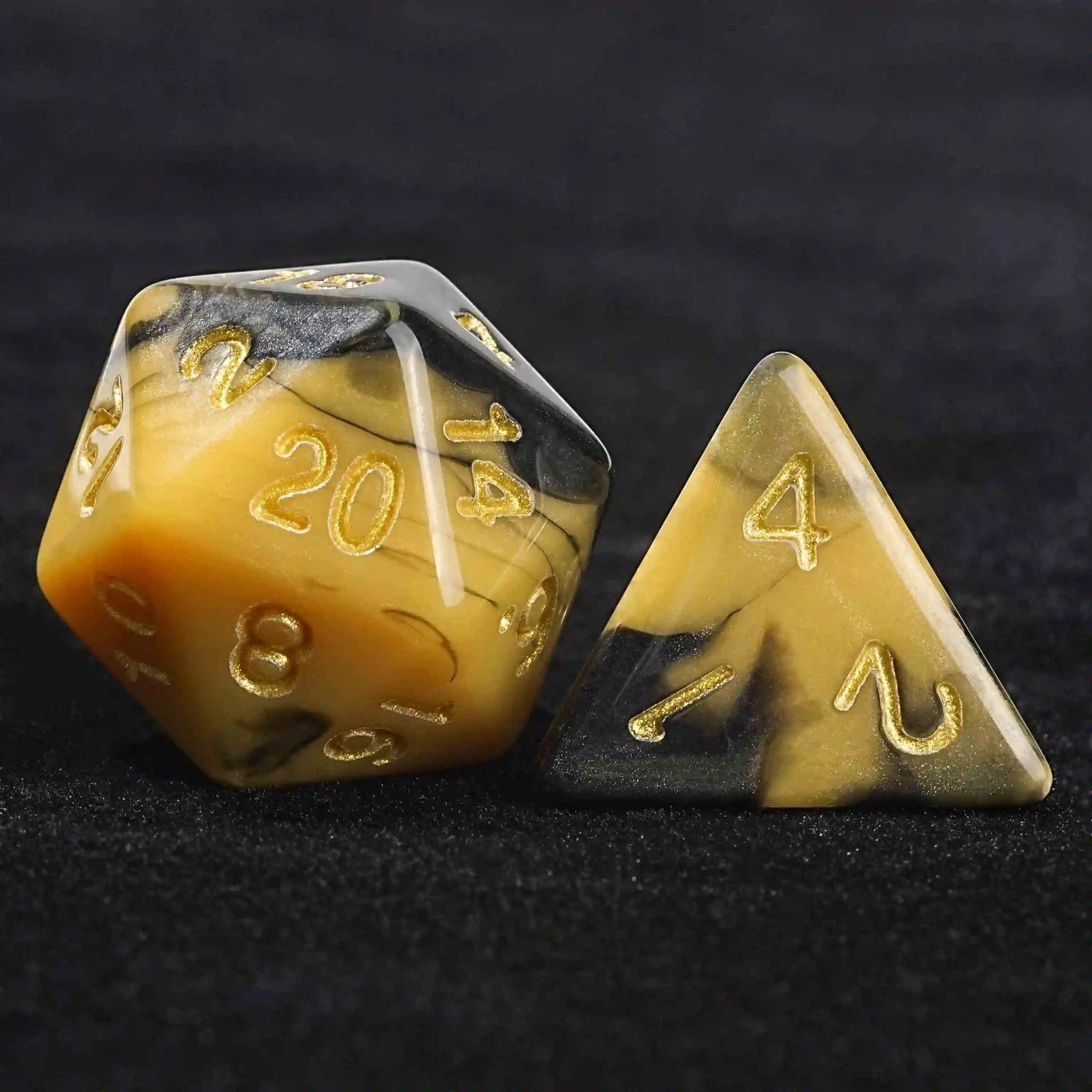 Black and yellow swirl Dungeons & Dragons polyhedron acrylic D20 and D4 dice with gold numbers | Bear Dice