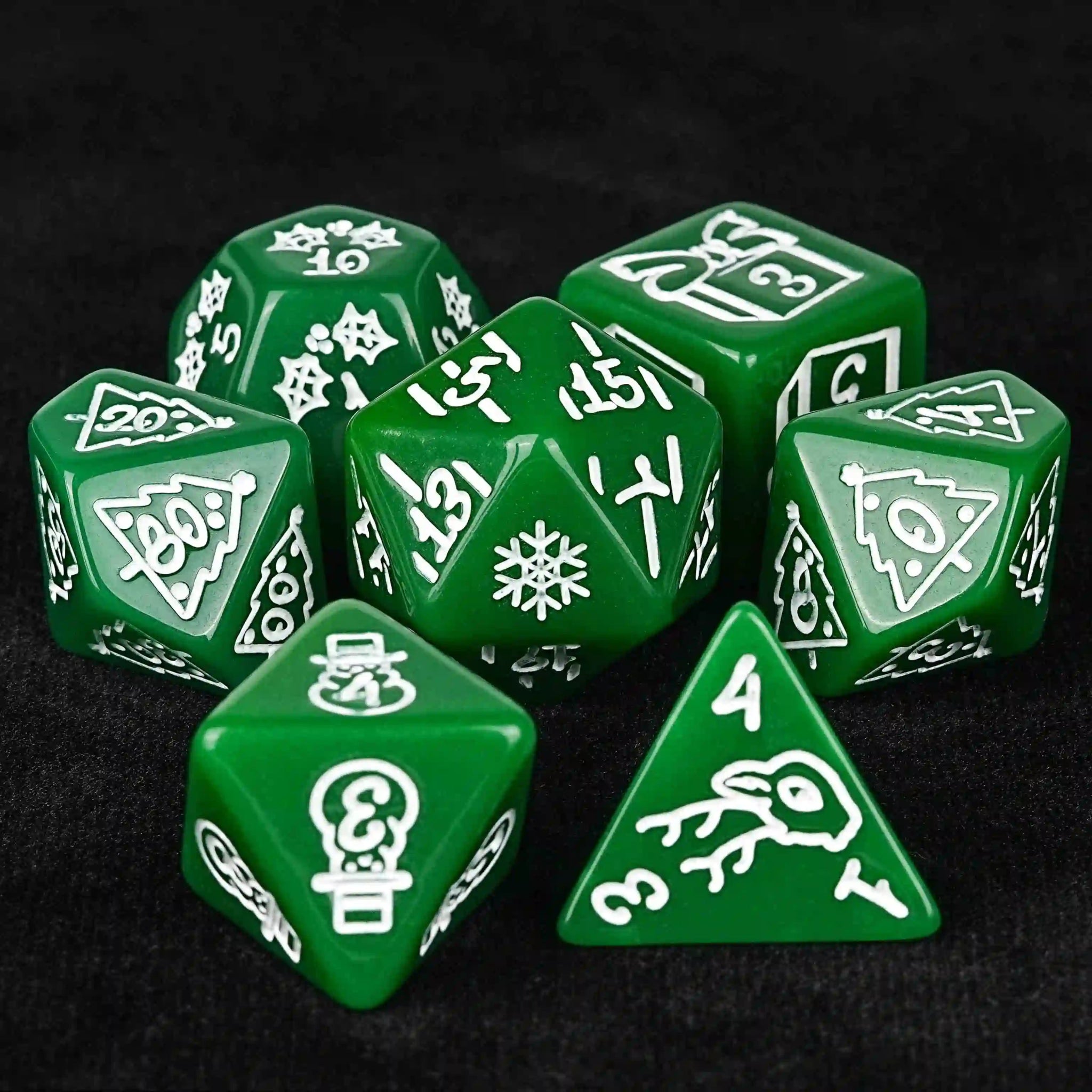 Green acrylic Christmas DND dice set, featuring white snowflakes, deer, Christmas trees, and other Christmas designs | Bear Dice