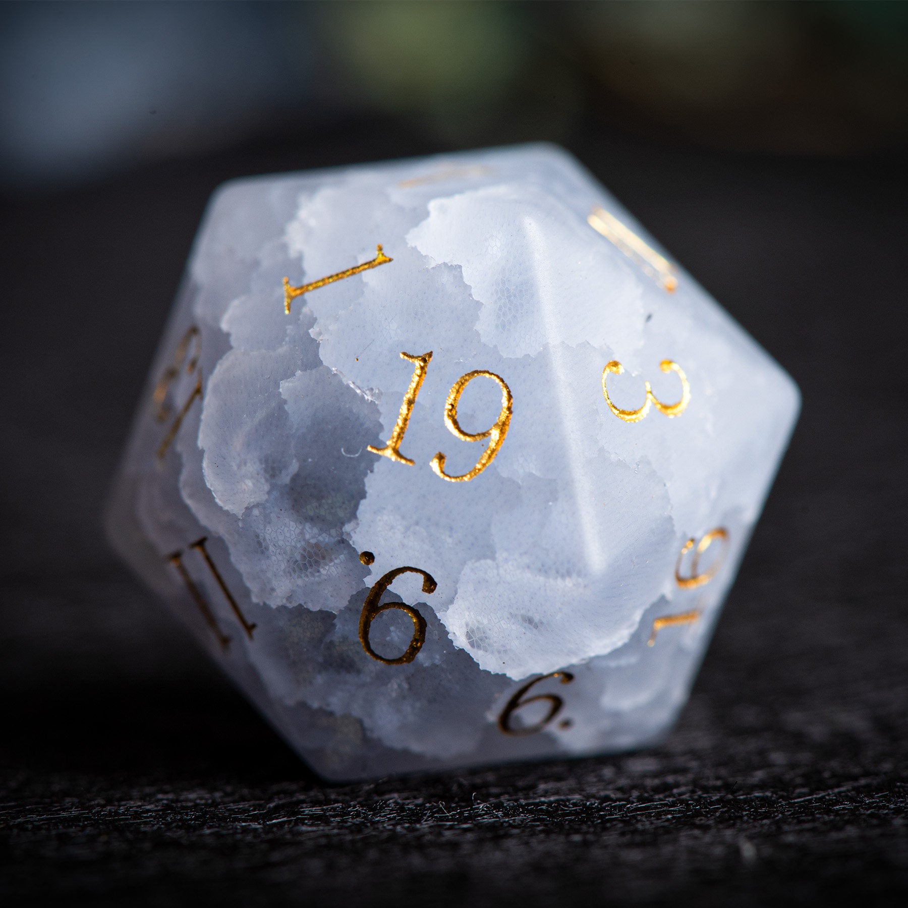 Grey-White Cat's Eye gemstone dice D20 close-up showing frosted cloud texture and gold numerals | Bear Dice