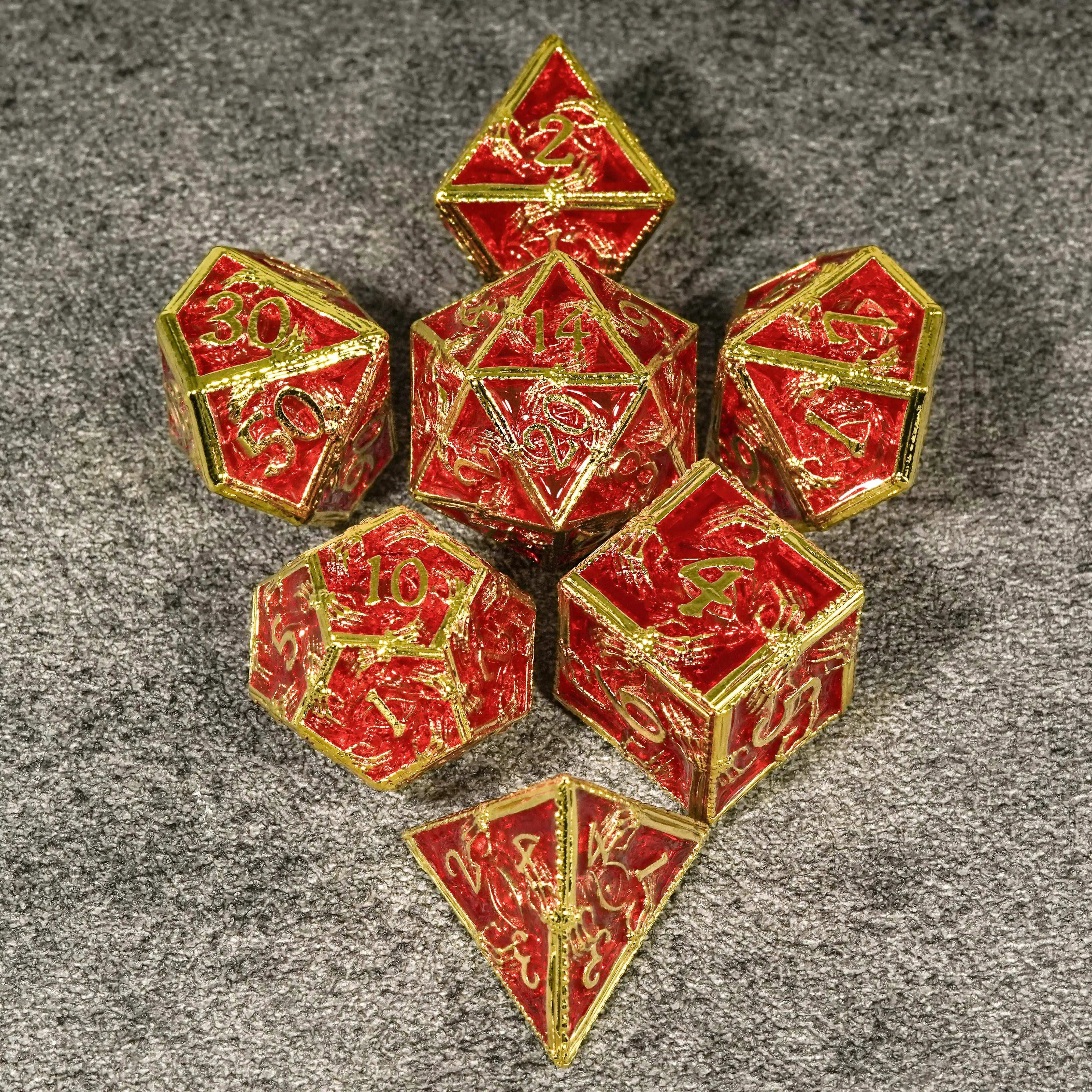Mysterious Mage's imitation gold red metal skeleton hand surrounds the DND dice set | Bear Dice