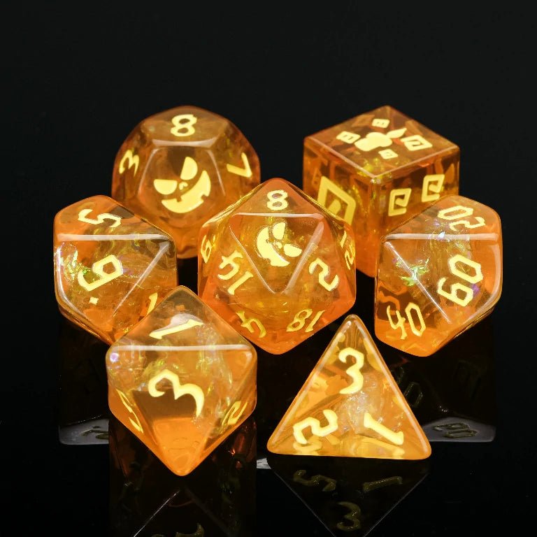 Halloween Trickster Dice - Kickstarter Yellow Resin DND Dice Set, engraved with Pumpkin Jack design, gold numbers resembling ghostly flames | Bear Dice