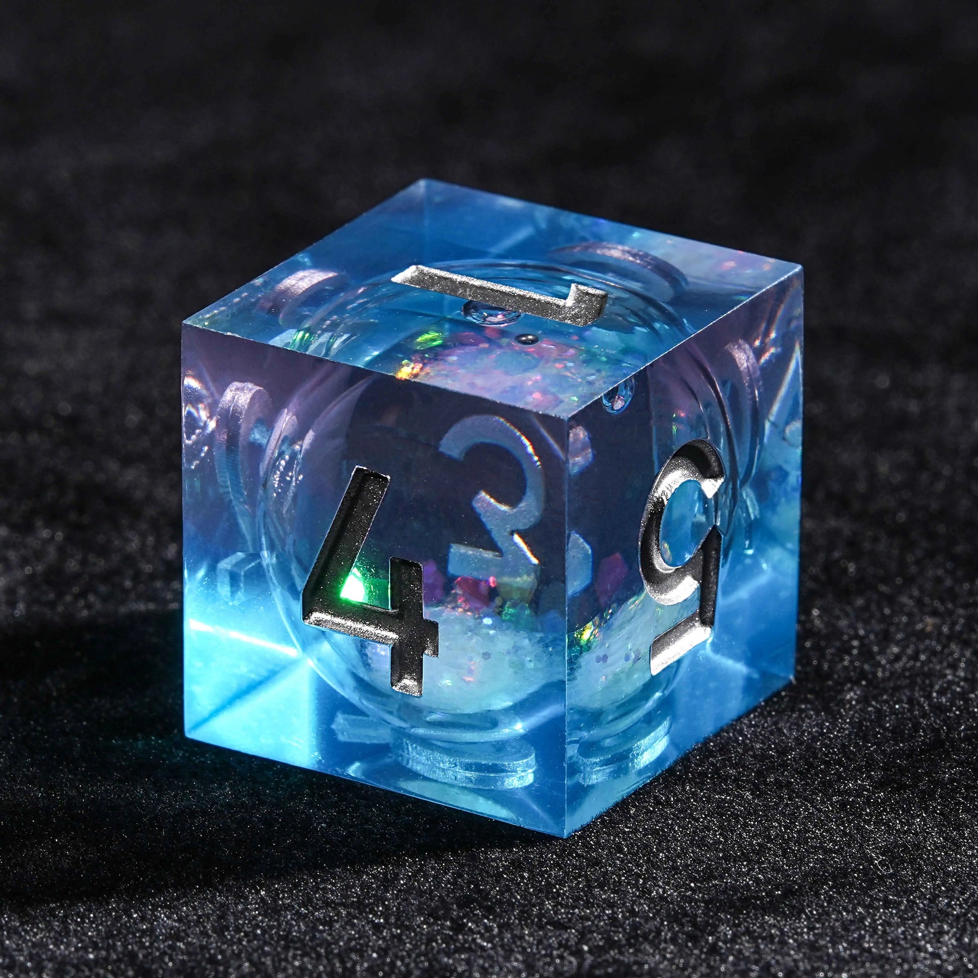 Blue resin D6 dice with colorful sequin quicksand cores | Bear Dice