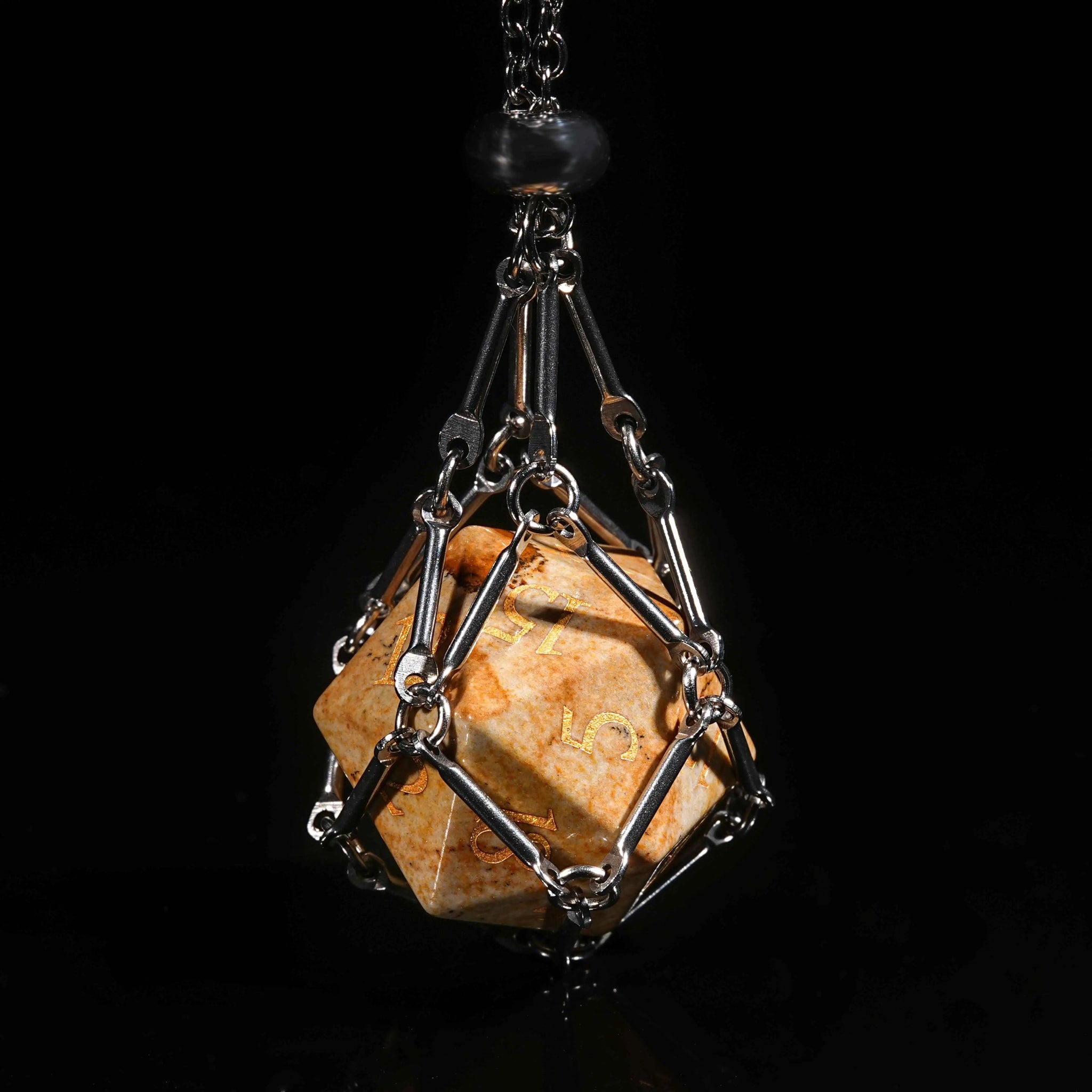 A silver dice necklace contains a muddy yellow rock textured DND natural stone D20 dice with gold numbers | Bear Dice