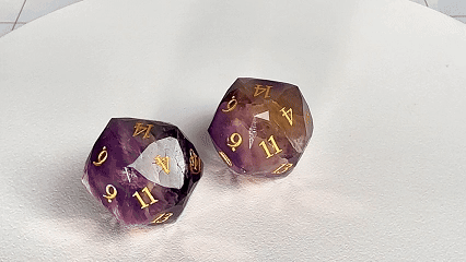 Two Natural Amethyst DND D20 Dice Engraved with the All-Seeing Eye Pattern are rotating | Bear Dice