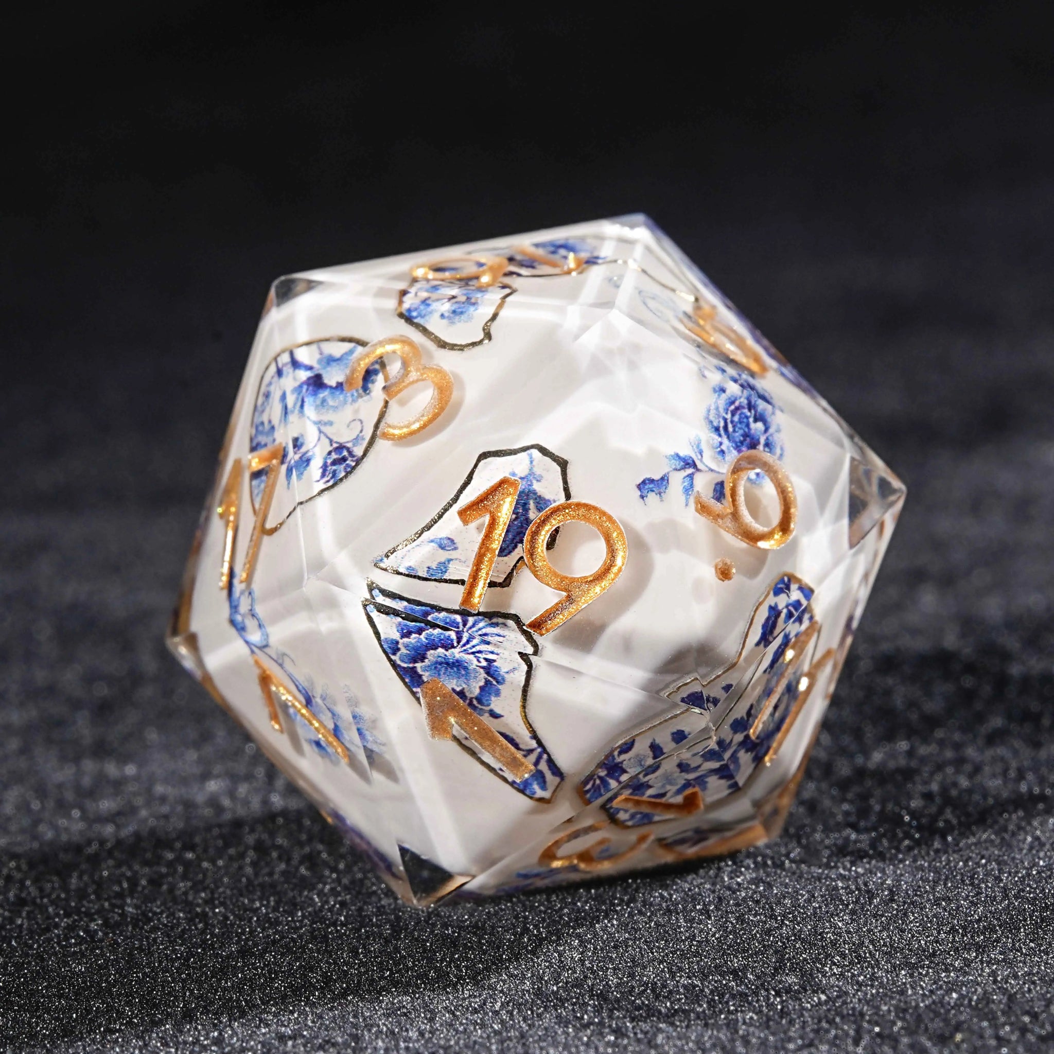 Transparent resin Oriental Blue and White Porcelain DND D20 dice, featuring a blue and white porcelain fragment pattern with blue flowers and plants | Bear Dice