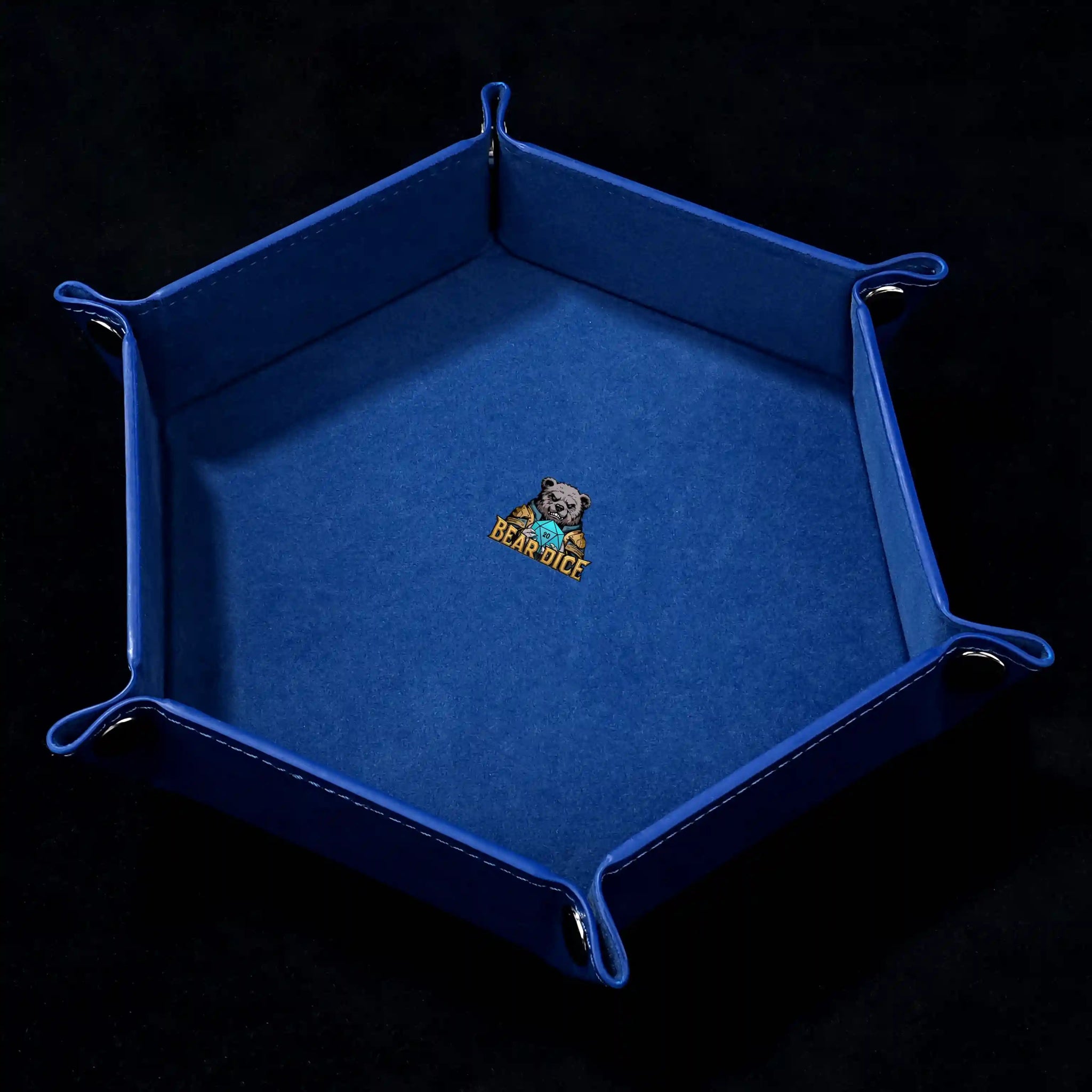 Hexagonal black PU leather RPG dice tray with silver buttons. Royal blue lining with the Bear Dice logo printed in the center. | Bear Dice