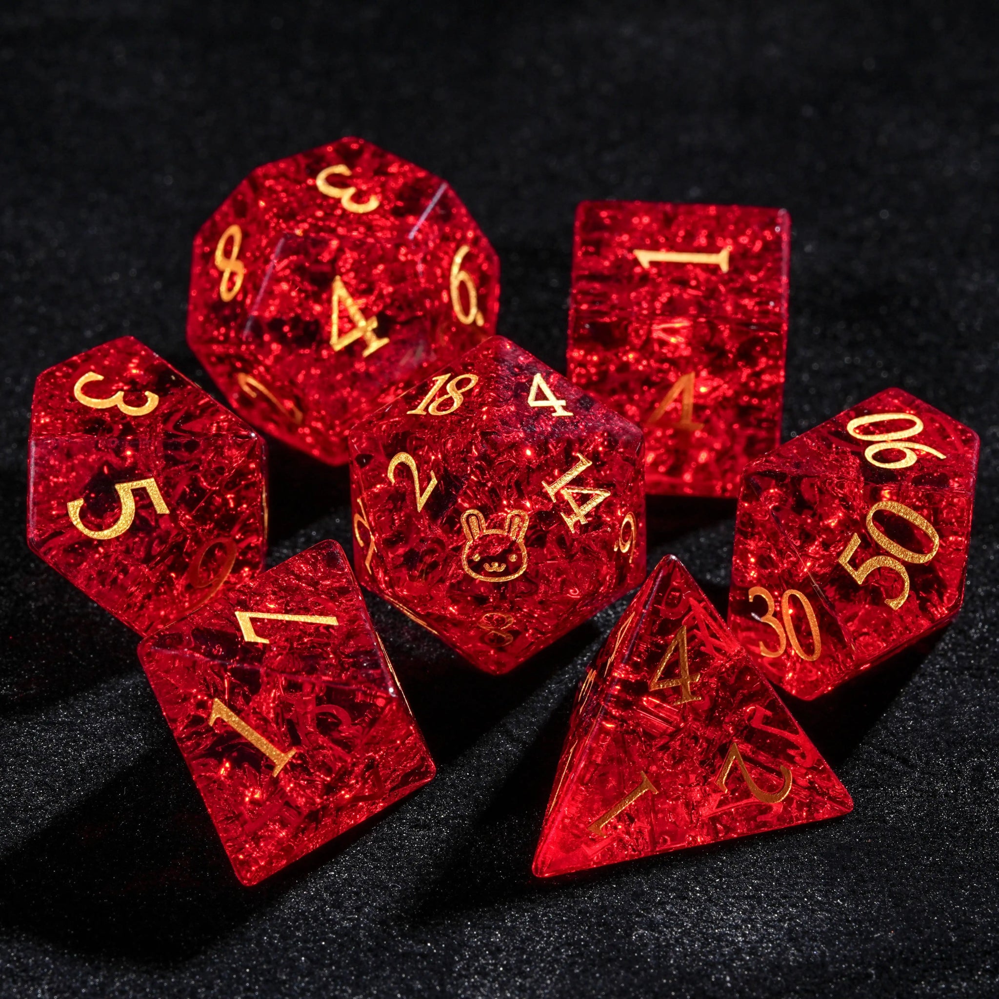Red glass DnD dice set with gold-engraved bunny design and numbers | Bear dice