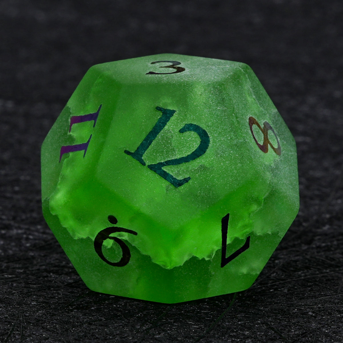 Green crackle frosted glass D12 die with multicolored electroplated numbers, showing the number 12 on the front face.
