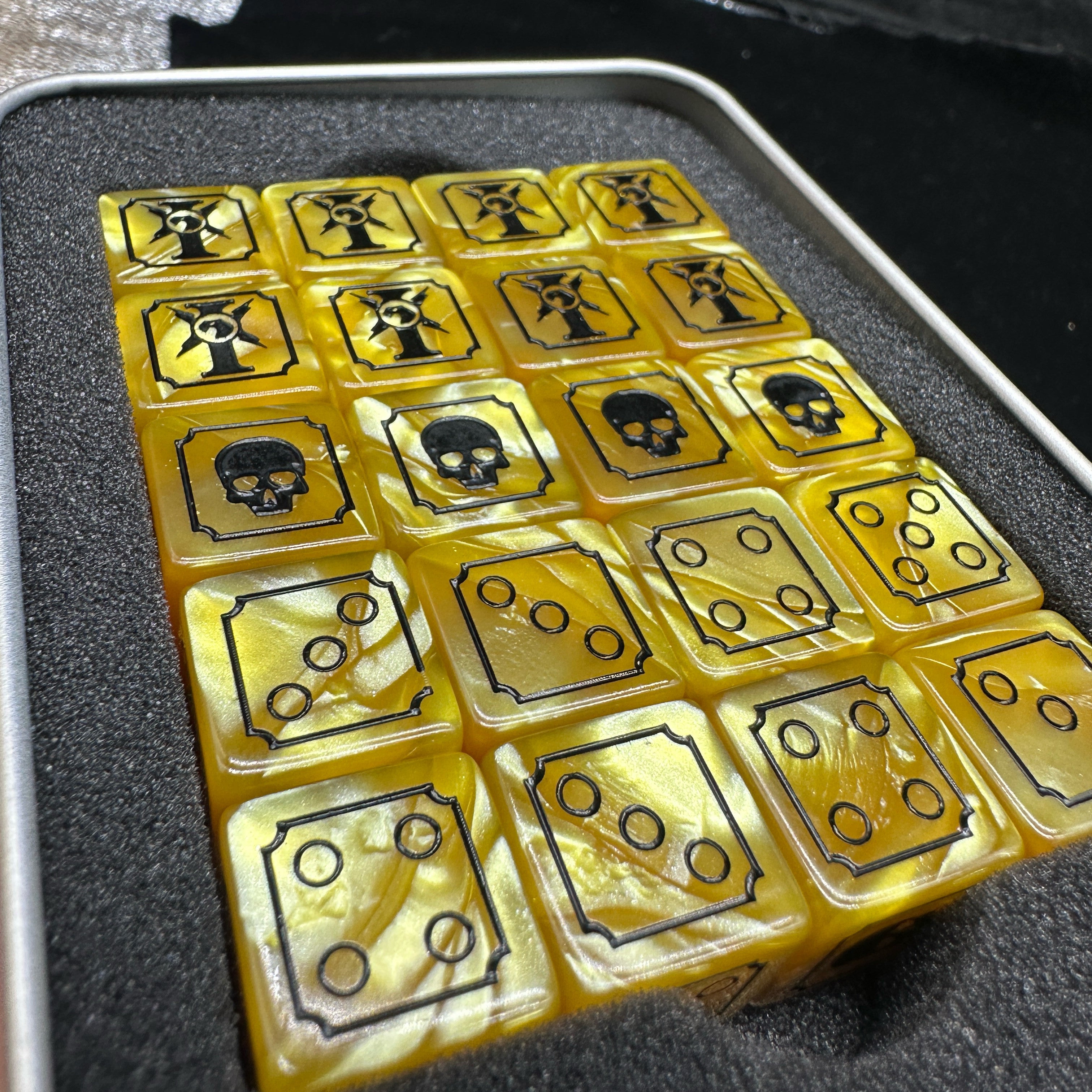 Warhammer 40K Imperial Guard Yellow Acrylic D6 Dice Set of 20 — Angled Top View in Open Metal Tin Box Showing All Face Designs Including Astra Militarum Badge, Skull and Pip Faces | Bear Dice